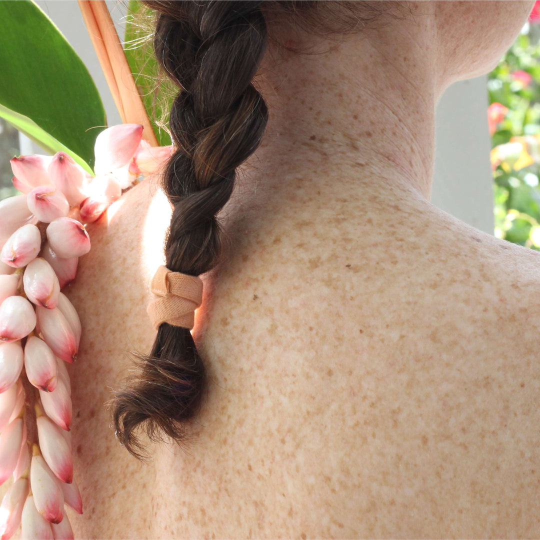 Ginger hair tie on braided hair.