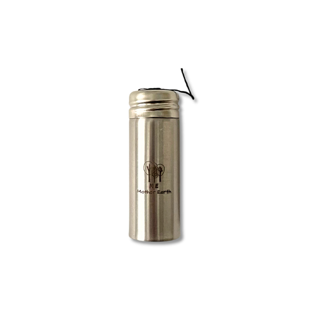 Bamboo charcoal fiber dental floss in stainless steel container.