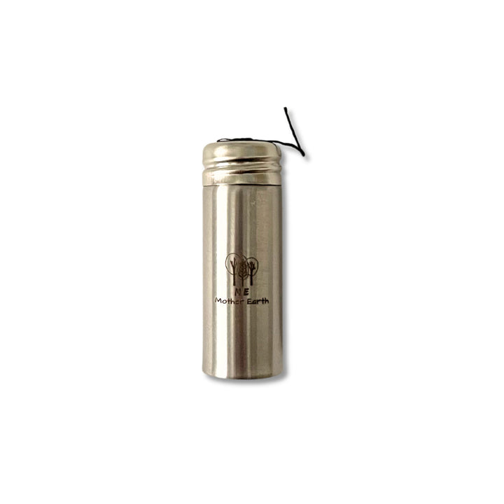 Bamboo charcoal fiber dental floss in stainless steel container.