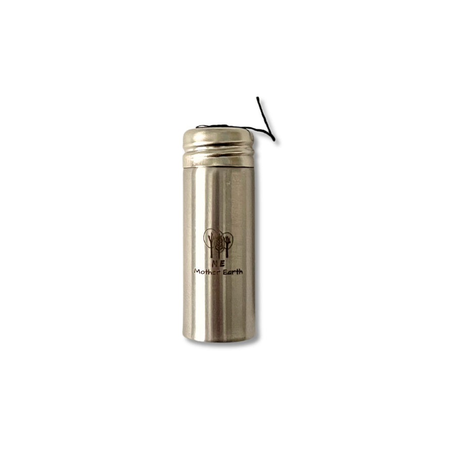 Bamboo charcoal fiber dental floss in stainless steel container.