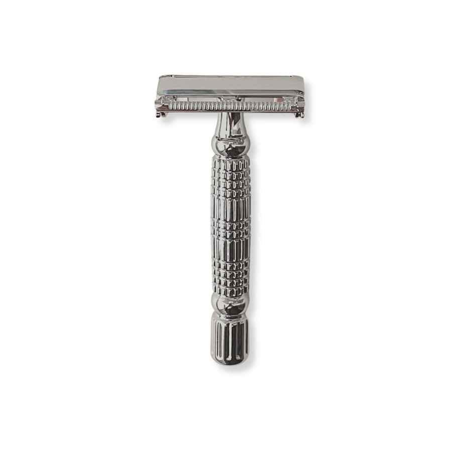 Double-edge safety razor in white chrome finish.