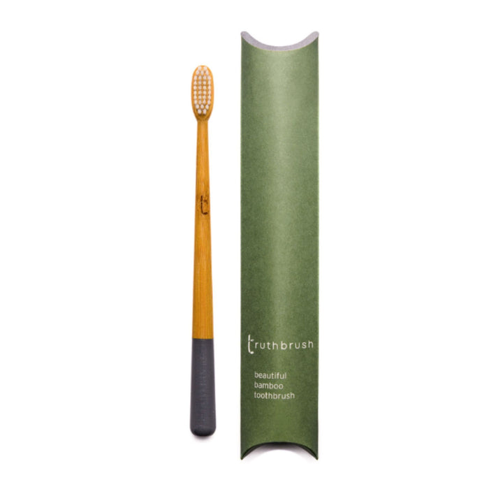 Bamboo Toothbrush for Adults with Storm Grey handle with plastic-free tube package.