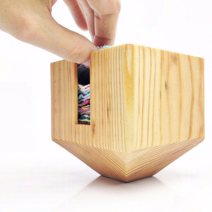 Marleys Monsters Wooden Facial Rounds Dispenser With Round Being Pulled From Container.