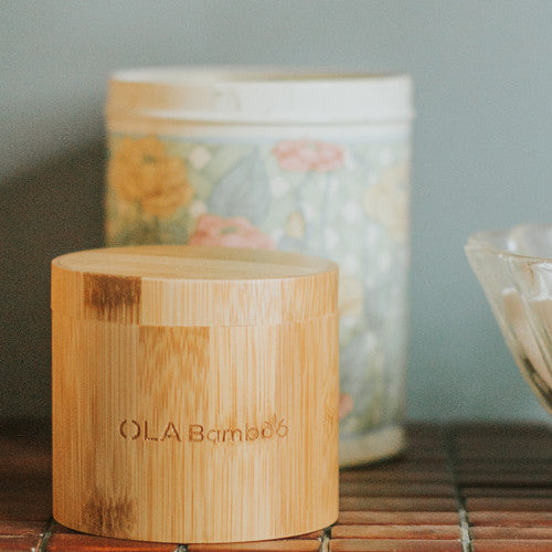 OLA Bamboo Eco Friendly Reusable Makeup Remover Pad Set In Closed Container On Bath Vanity.